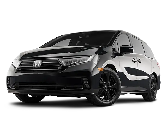 Spacious White Honda Odyssey Minivan Parked in Suburban Driveway